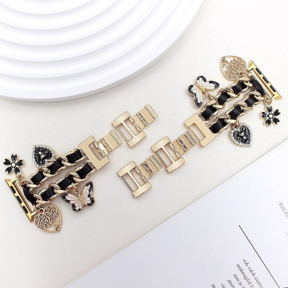 Apple Watch (38 / 40 / SE / 41 / 42mm) - EIDERWOOD Metal Rem m. Vegansk Læder & Vedhæng - Guld / Sort